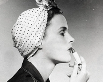 Vintage image of woman applying makeup in the 1940s Vintage image of woman applying makeup in the 1940s