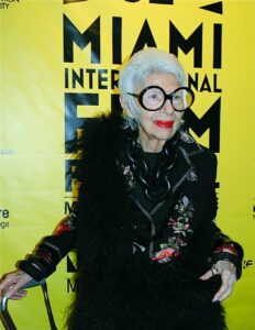 Person wearing a black feathered coat at the Miami International Film Festival. Person wearing a black feathered coat at the Miami International Film Festival.