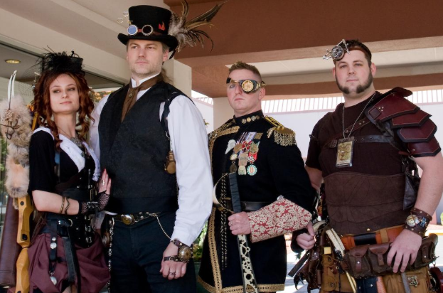 A photo of four people in steampunk costumes with top hats and goggles. A photo of four people in steampunk costumes with top hats and goggles.
